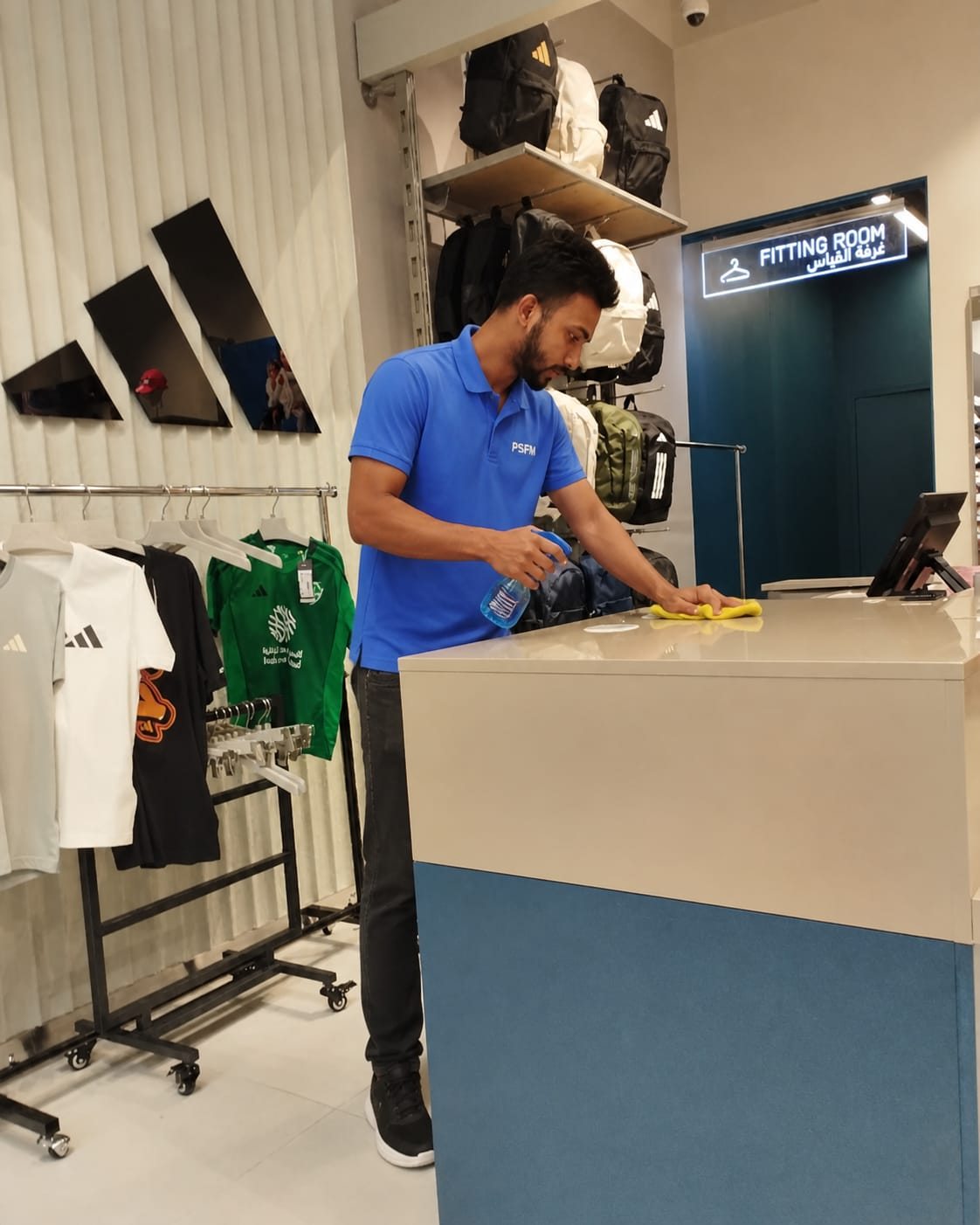 PSFM retail cleaning staff at a client counter