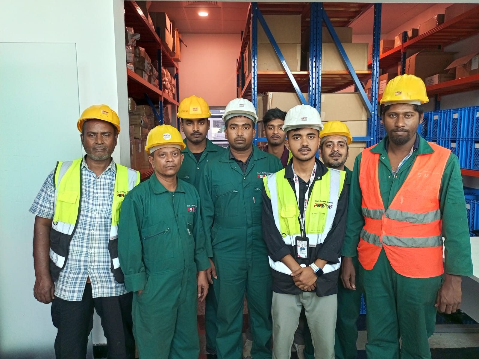 PSFM warehouse and technical manpower team in safety uniforms